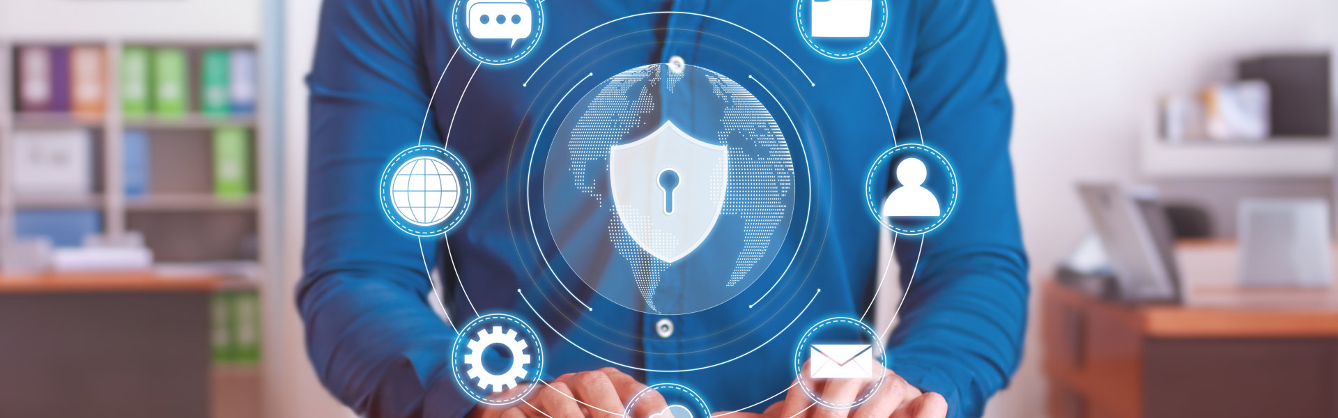 A person in a blue shirt interacts with digital security icons and a globe, emphasizing cybersecurity and data protection.